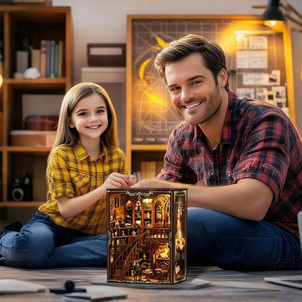 Adult and child seated beside a completed Ancient Rhyme Library book nook.