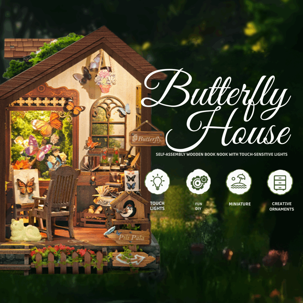 Butterfly House open room showing specimen pictures, furniture and a flower-filled window.