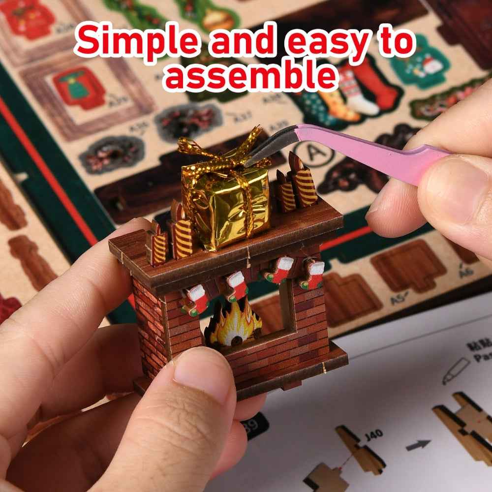 Tweezers placing a small present on the Christmas Shop miniature fireplace mantel.