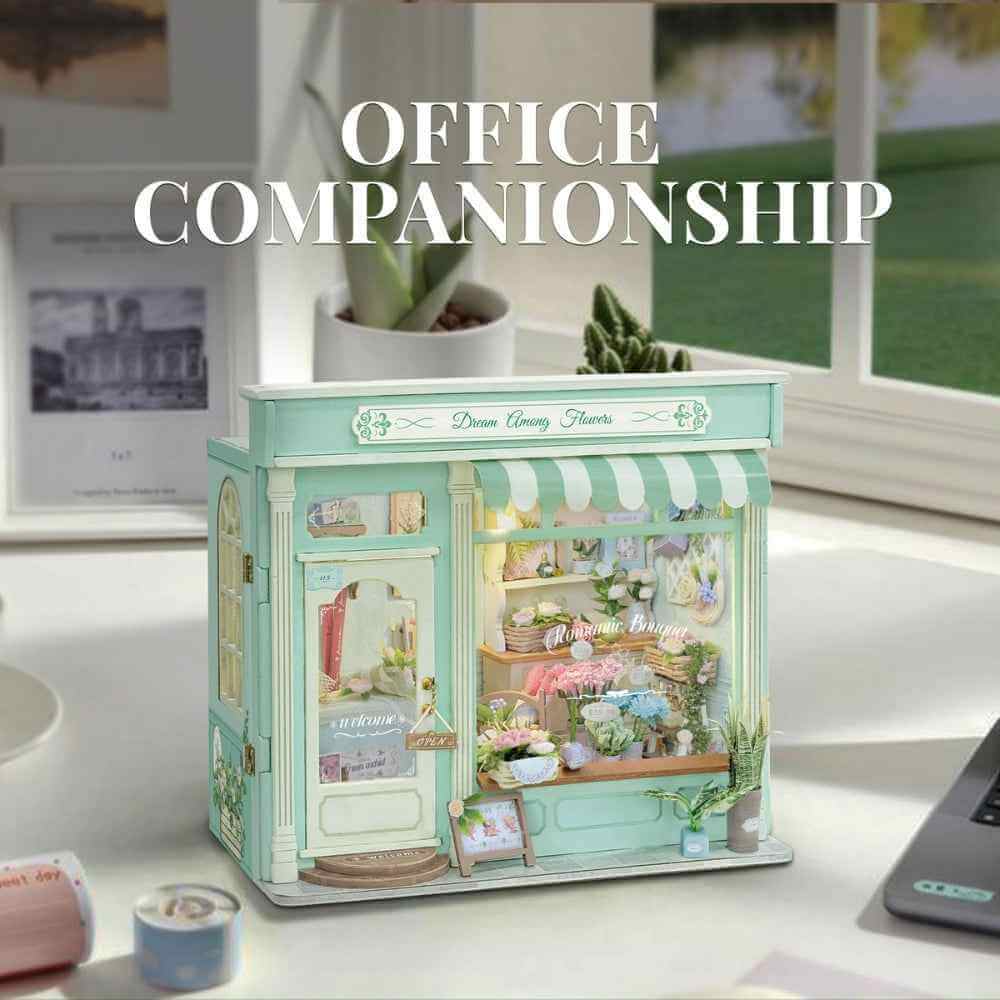 Floral Dream miniature flower shop on an office desk beside a window.
