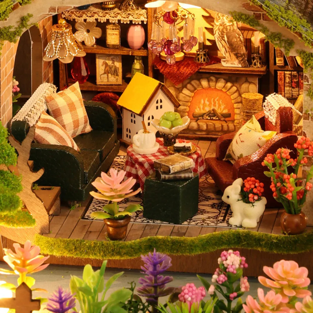 Forest Adventure living room with a glowing fireplace, cushioned chairs and tiny plants.
