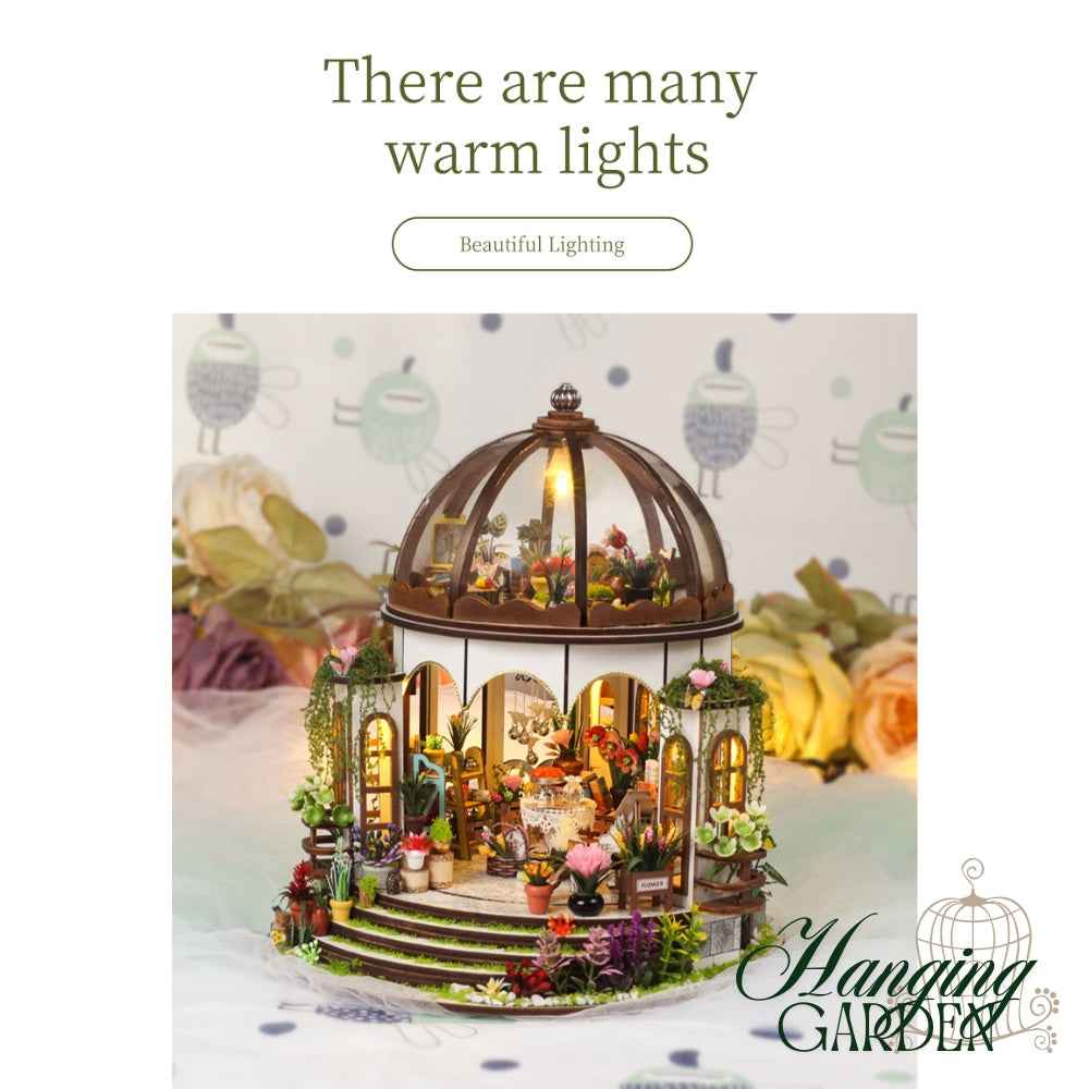 Hanging Garden model with warm lights glowing beneath the domed roof.