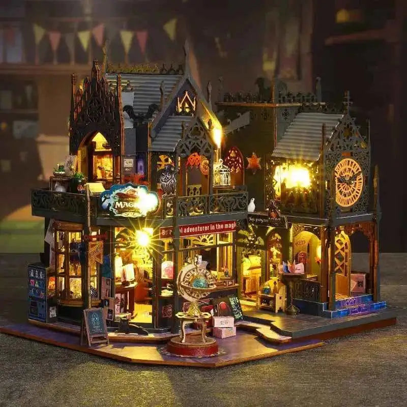 Holo Magic City displayed on a table against a bunting backdrop, with its street lamps lit.