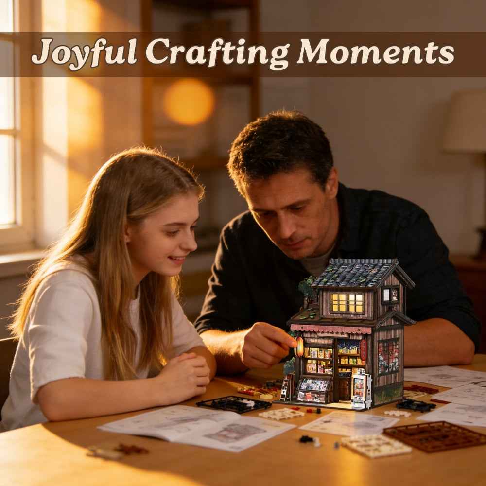 Adult and teenager assembling the Kasuga Grocery Store miniature shop.