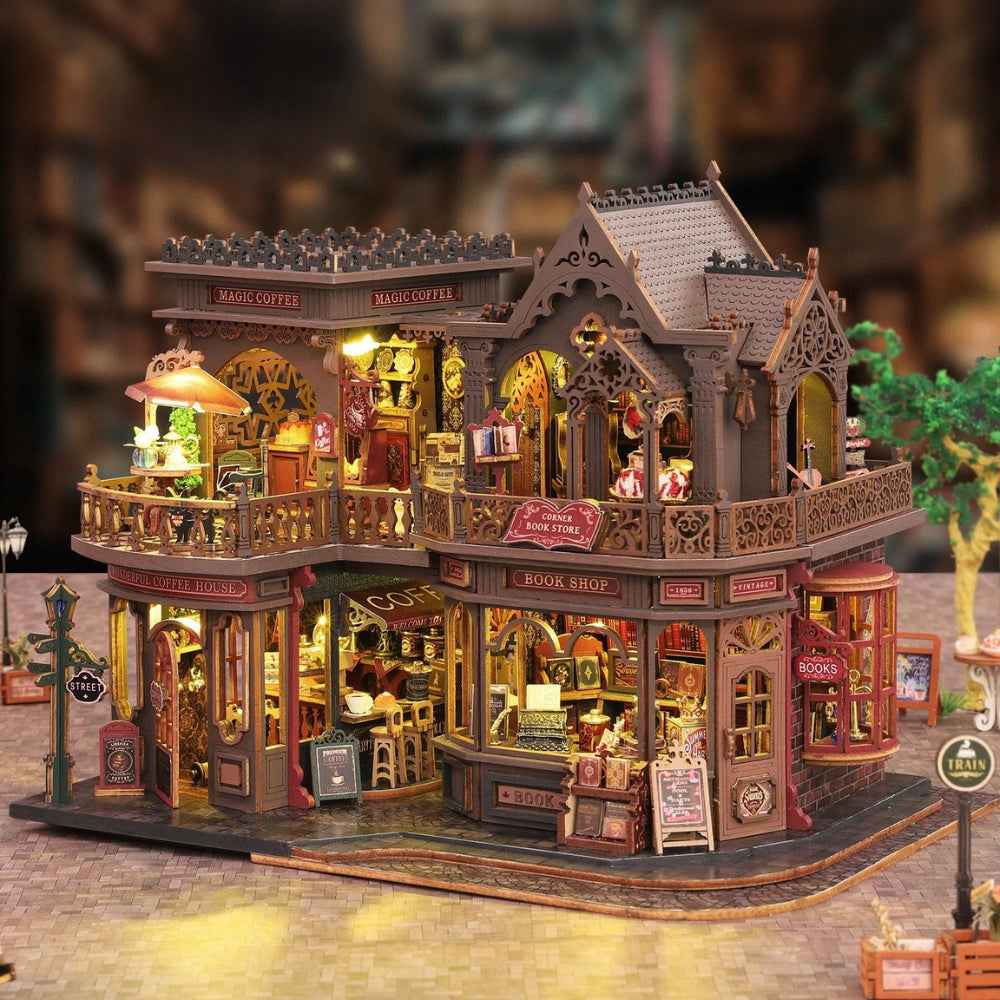 Letter Coffee miniature building with two stories of café rooms, balconies and book displays.