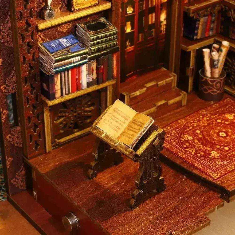Miniature bookshelves, steps and an open book on a reading stand inside Library of Books.