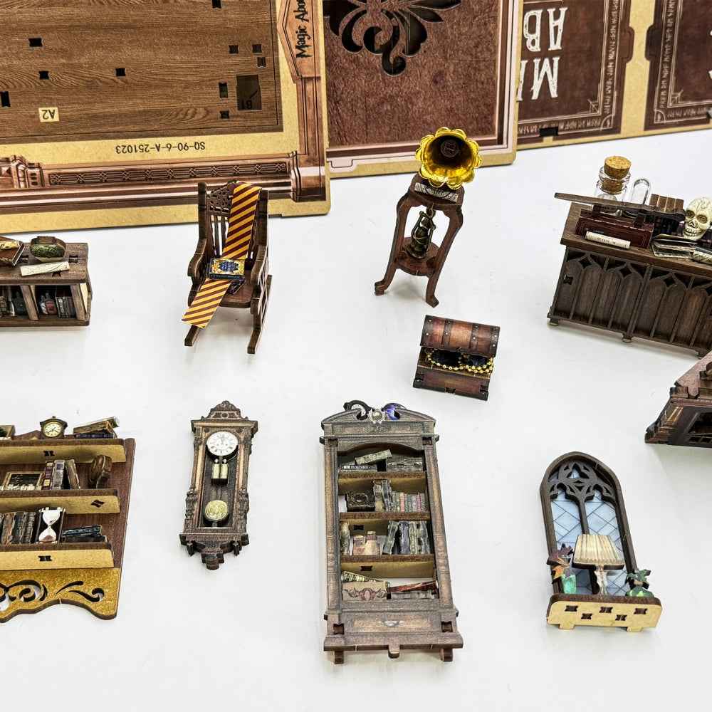 Magic Abode miniature furniture, gramophone, clock and window pieces laid out for assembly.