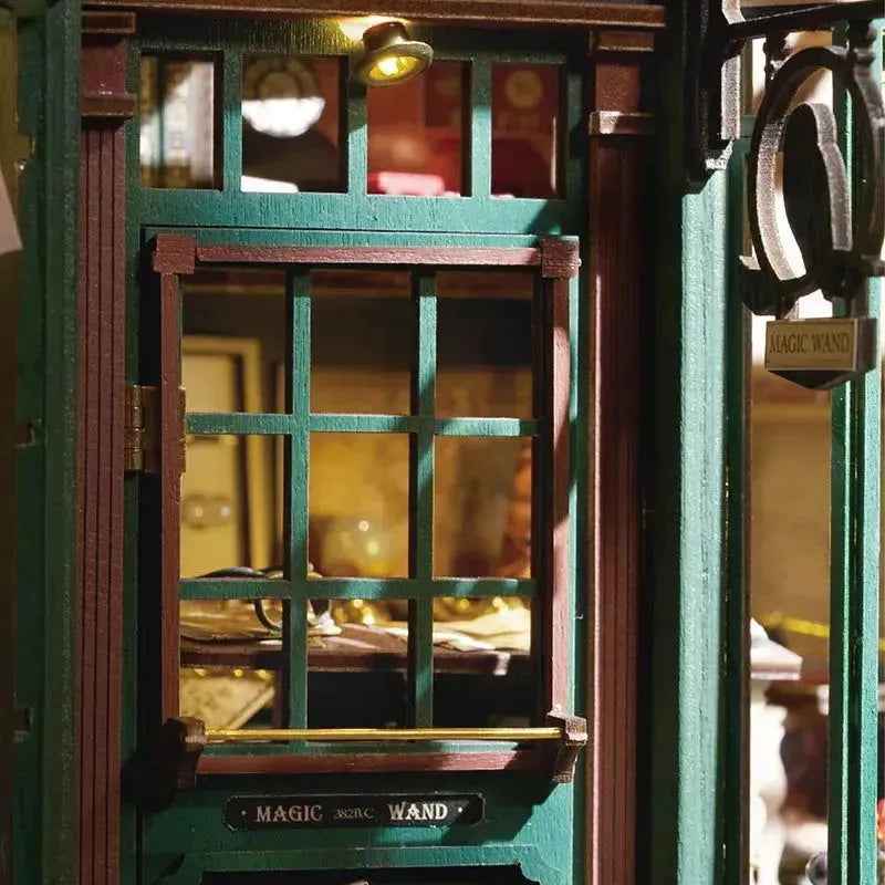 Green doorway and Magic Wand shop sign on the Magic House book nook.