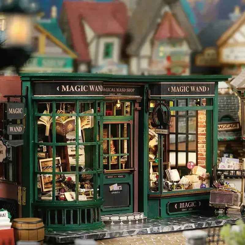 Front view of Magic House book nook with a green wand-shop window and doorway.