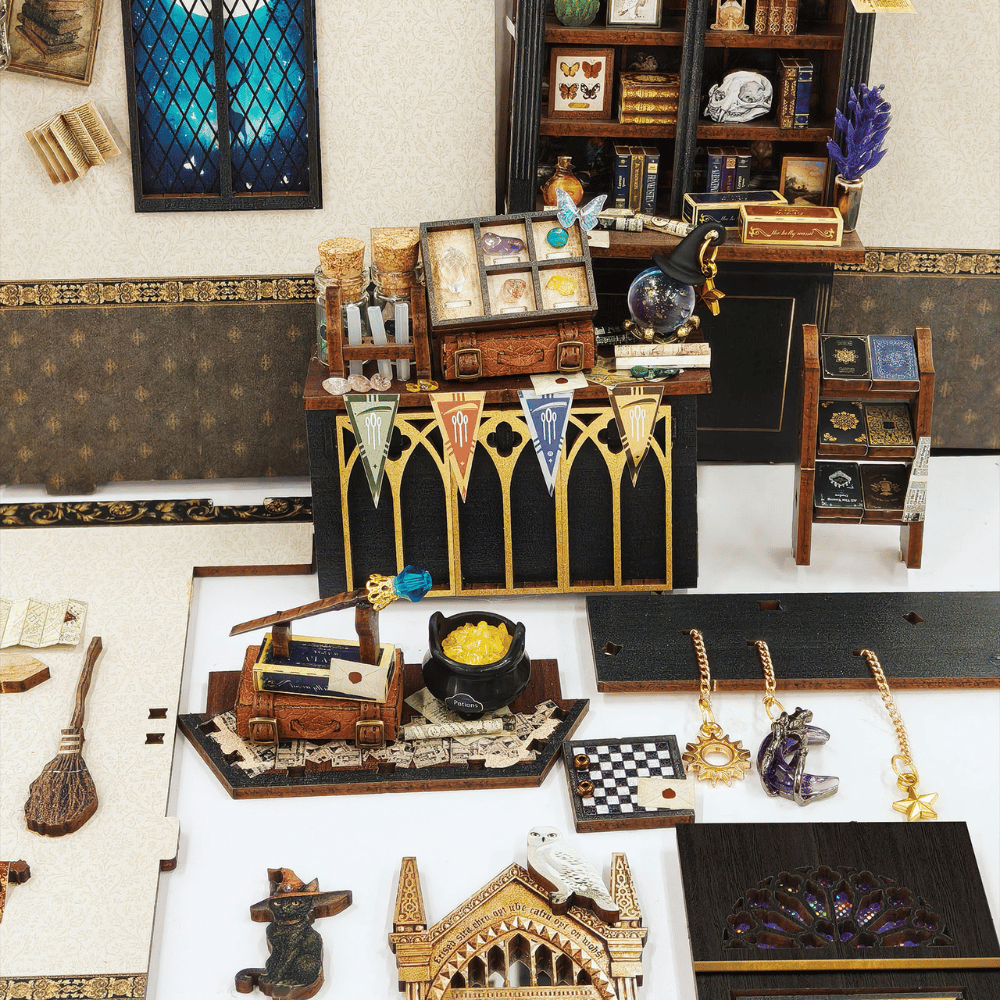 Magic Oddities Store miniature shop panels, counter and magical objects laid out for assembly.