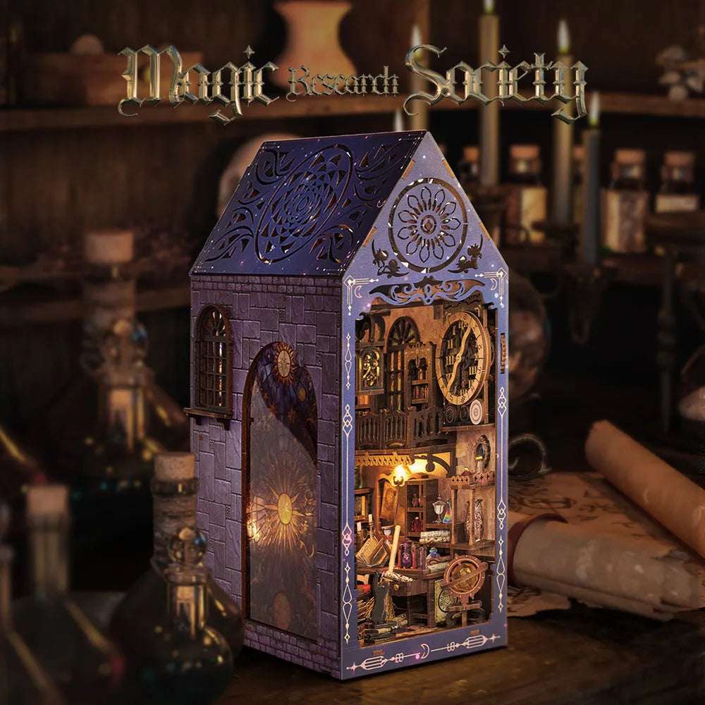 Magic Research Society book nook with a pointed purple frame and ornate miniature study inside.