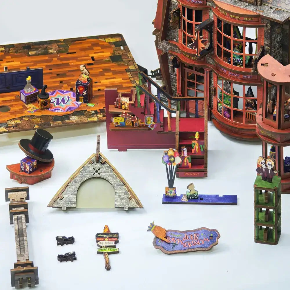 Magic Wonder House miniature counters, props and structural panels arranged for assembly.