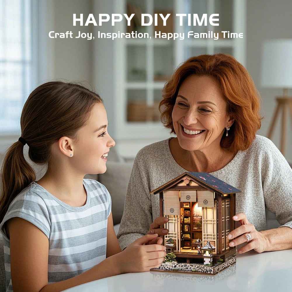 Woman and girl holding a completed Moss-Lantern Harmony Garden model.