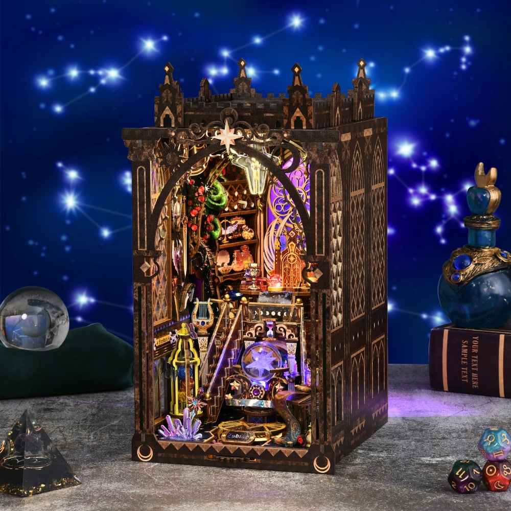 Mystic Zodiac book nook against a starry backdrop with ornate gold trim and purple interior lighting.