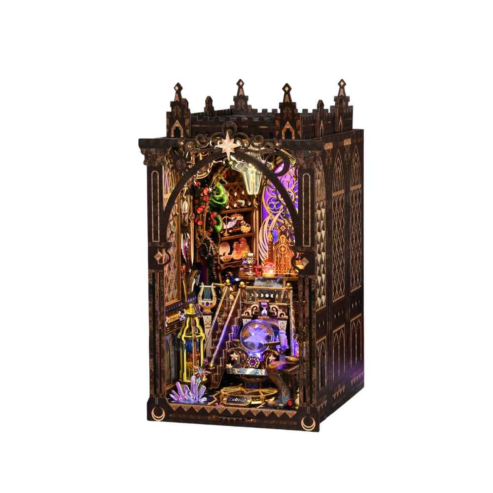Mystic Zodiac book nook against a white background with its ornate dark frame and purple lighting.