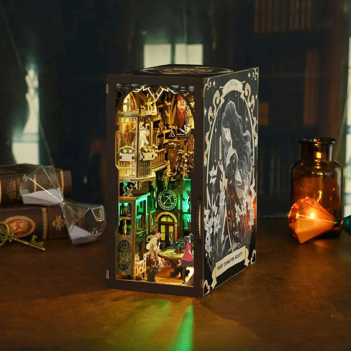 Tarot Divination Society book nook with a dark illustrated cover and green-lit interior.