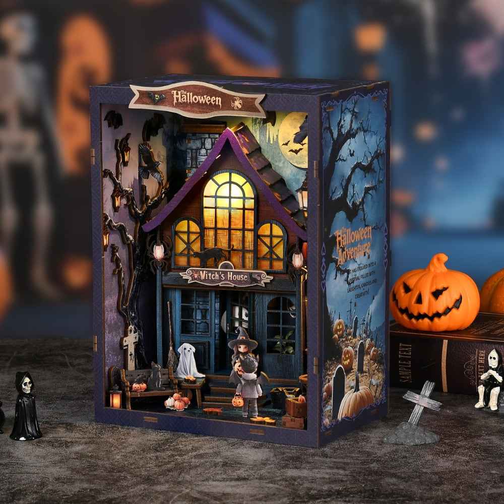 The Magical Night at the Castle book nook with a witch's house, pumpkins and a glowing upper window.