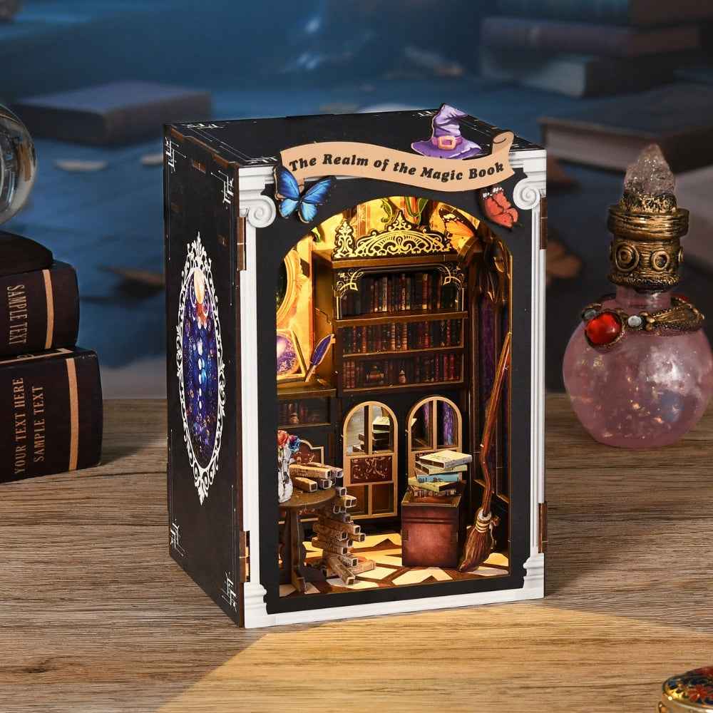 The Realm of the Magic Book book nook with miniature library shelves and a glowing arched window.