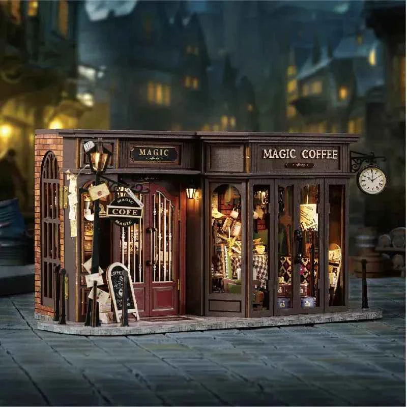 Angled Vintage Coffee Shop model on a miniature street, with lit windows and a clock sign.