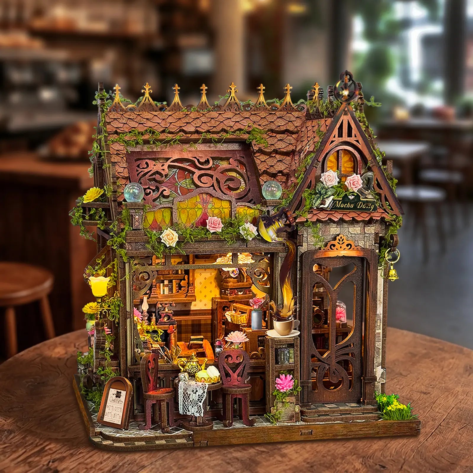 Mocha Diary DIY Mini House Kit glowing with warm LED interior lights
