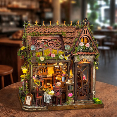 Mocha Diary DIY Mini House Kit glowing with warm LED interior lights