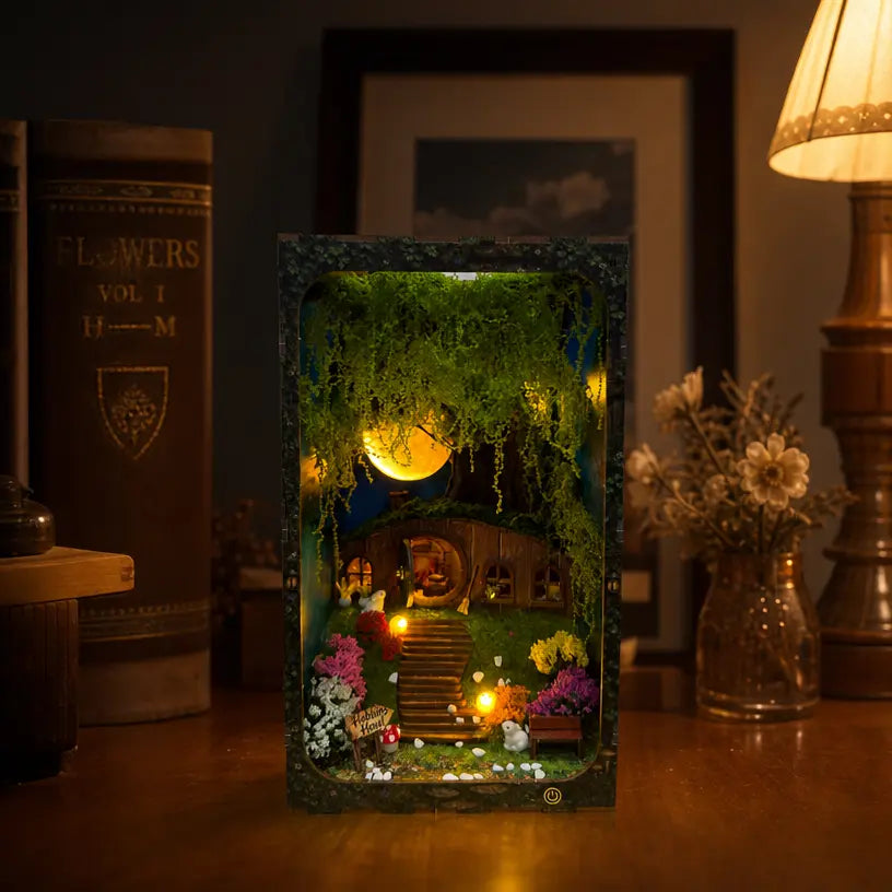 Hobbins Hovel hobbit cottage DIY book nook main front image, glowing forest miniature bookend diorama