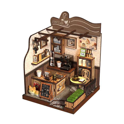 Angled 1987 Country Café miniature room with a coffee counter, stools and wall shelves.