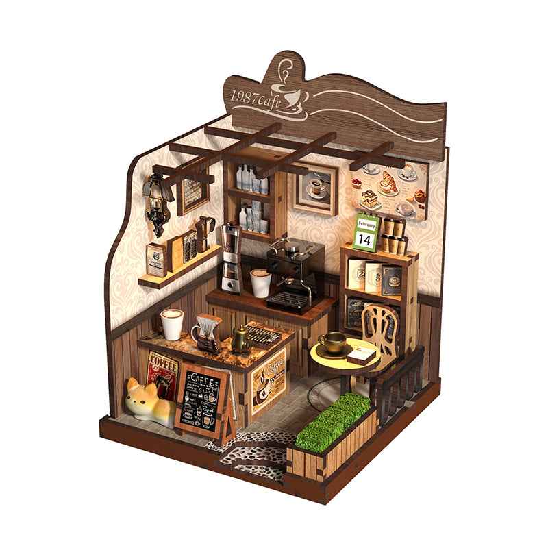 Angled 1987 Country Café miniature room with a coffee counter, stools and wall shelves.