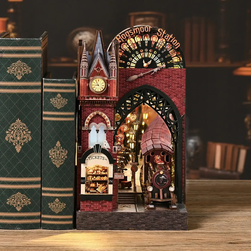 DIY book nook kit with warm LED lighting on a bookshelf - Hogsmoor Station by ROCOXIA