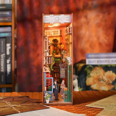 Illuminated 84 Charing Cross Road book nook with a miniature London bookshop and street scene.