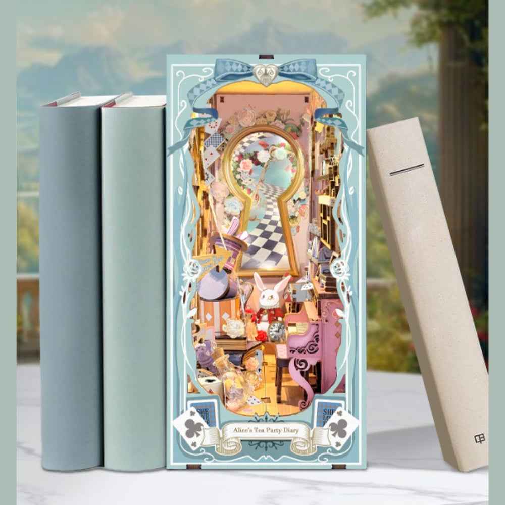 Alice's Tea Party Diary book nook between books with a pale blue frame and keyhole-shaped interior.