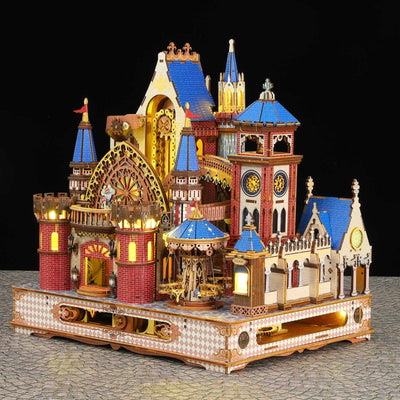 Annecy Castle miniature model with blue-roofed towers, warm lighting and a decorated base.