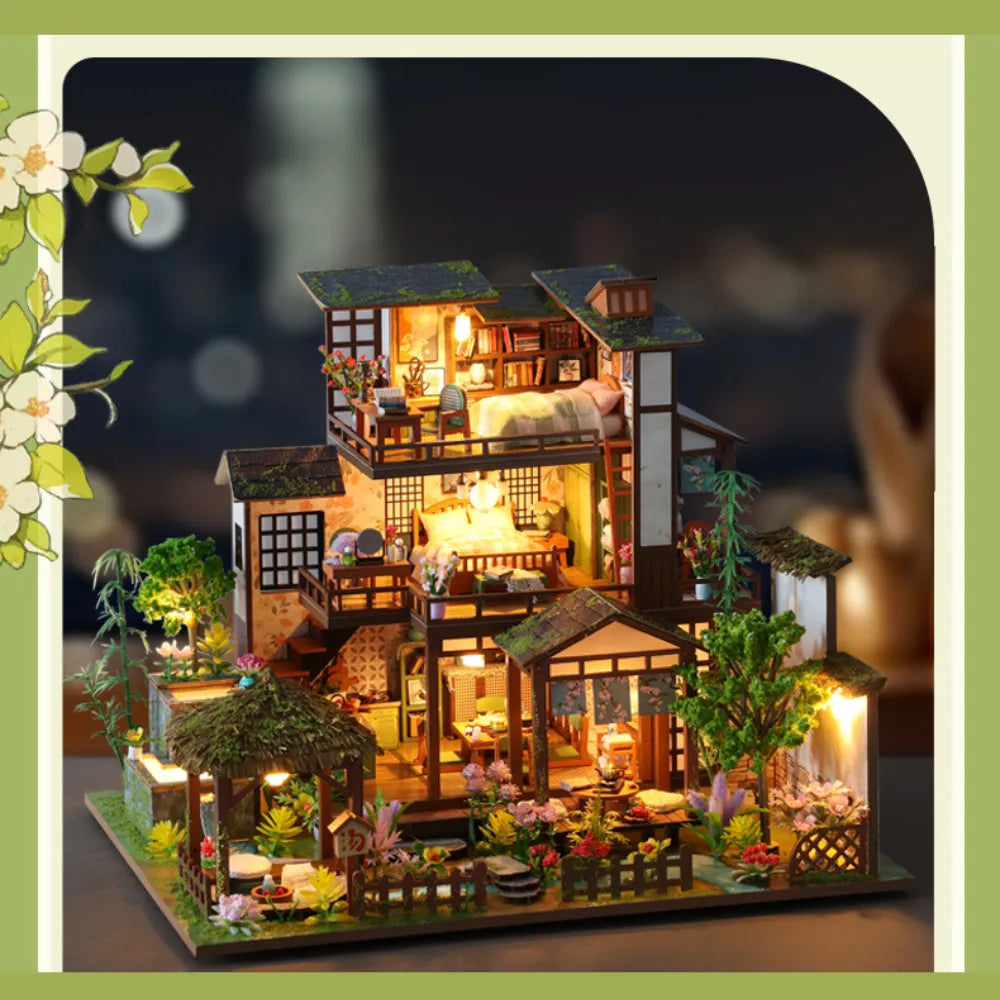 Bamboo Spring Courtyard miniature house illuminated against a dark background.