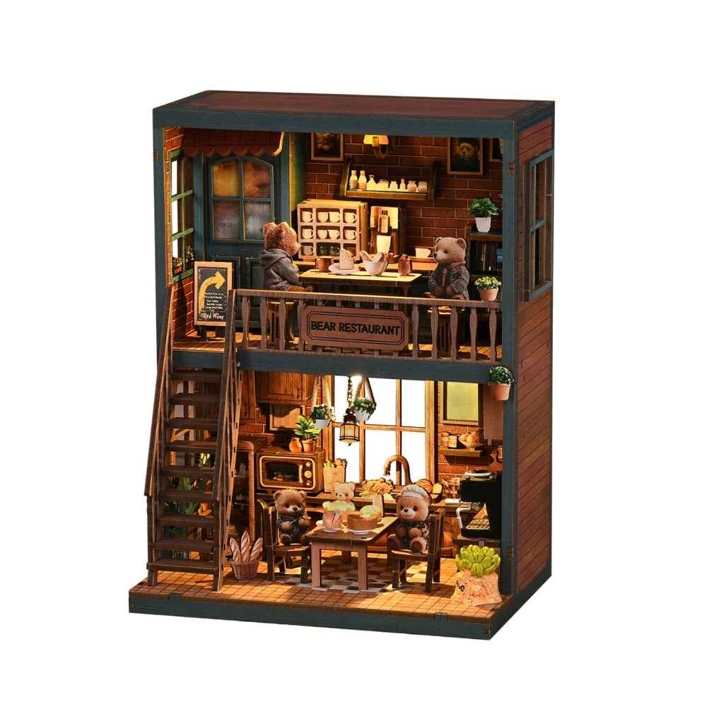 Front view of Bear Restaurant against a white background, with miniature diners on both floors.