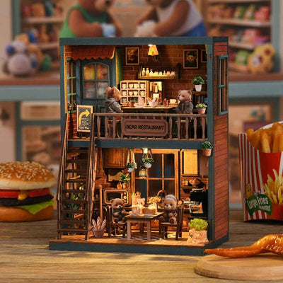 Bear Restaurant book nook with two floors of dining tables, tiny bears and a staircase.