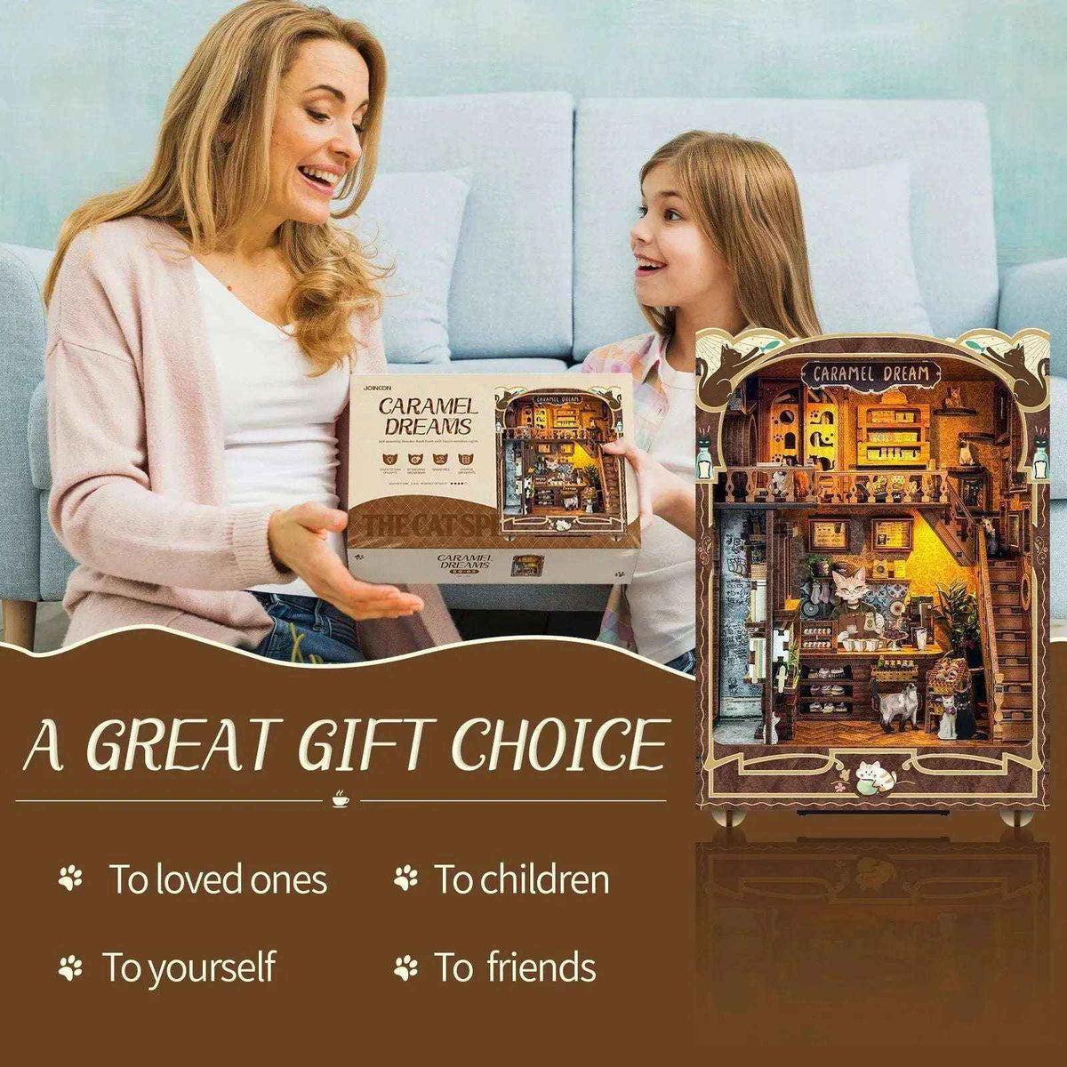 A woman and girl with the Caramel Dreams kit box and completed miniature cat café.