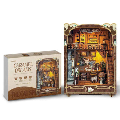 Completed Caramel Dreams book nook displayed beside its illustrated kit packaging.