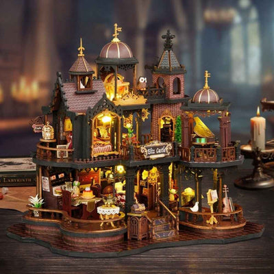 Edinburgh Castle miniature house with domed towers, balconies and warmly lit open rooms.