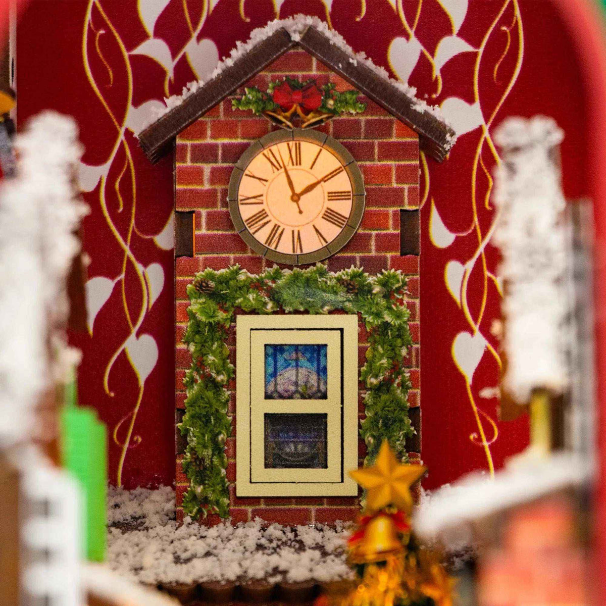 Close-up of the brick clock tower and wreath-trimmed window inside Enchanted Christmas.