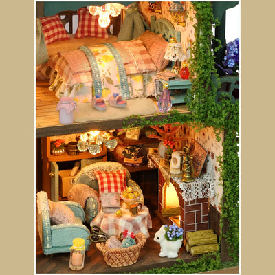 Fairy Garden bedroom and living-room details with patterned cushions and a fireplace.