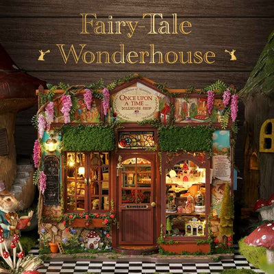 Fairy-Tale Wonderhouse front view with trailing flowers, green foliage and a central wooden door.
