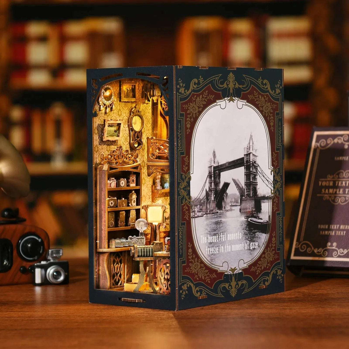 Film Darkroom book nook with an illustrated photographic cover and glowing miniature studio.