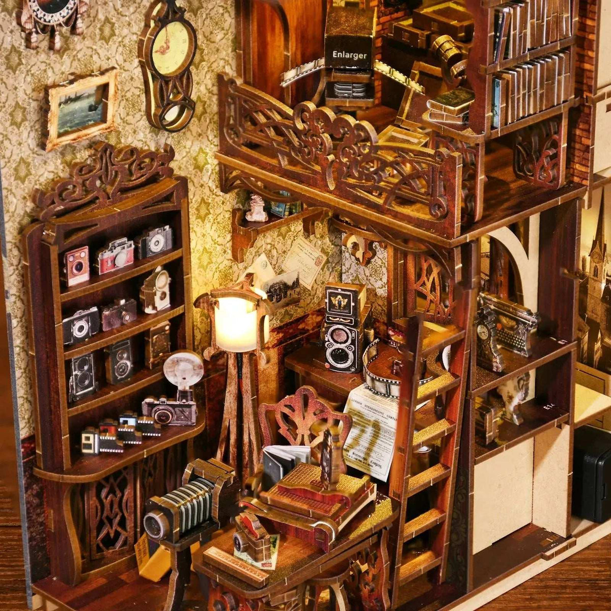 Film Darkroom interior with vintage cameras, shelving, an ornate balcony and miniature photographs.