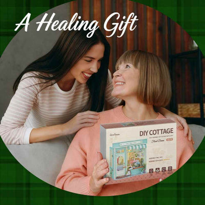 Two women holding a Floral Dream DIY Cottage kit box.