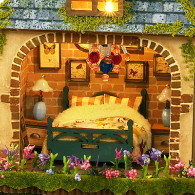Forest Adventure miniature bedroom with a green bed beneath a brick-patterned arch.