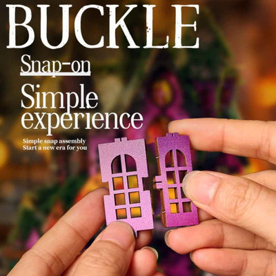 Hands fitting purple window pieces for the Halloween Night miniature house.