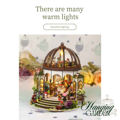 Hanging Garden model with warm lights glowing beneath the domed roof.