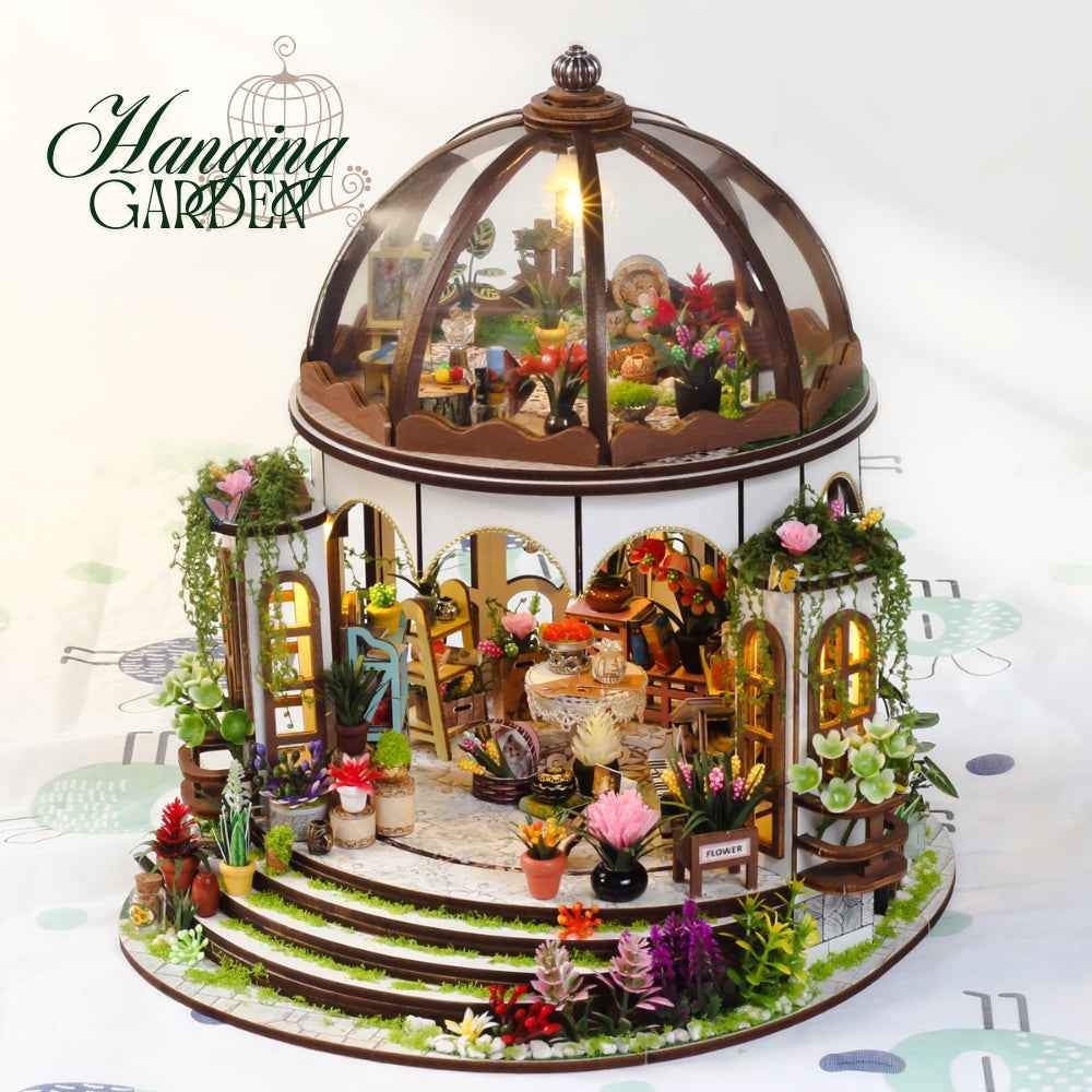 Hanging Garden miniature conservatory with a domed roof, flowers and circular entrance steps.