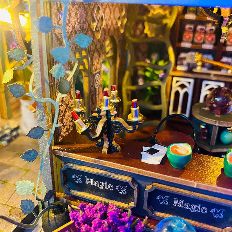 Hollow Magic Coffee Shop miniature counter with a candelabrum and cup.