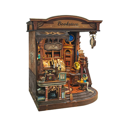Left-side view of Inchspace Bookstore showing the miniature counter and book-lined wall.
